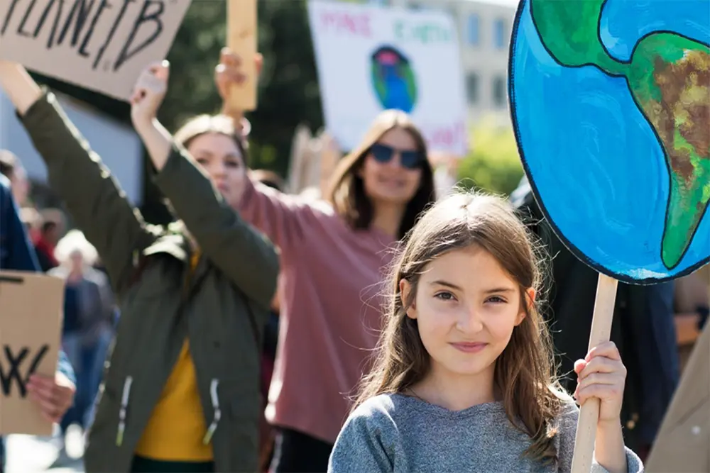 Community members at a rally holding signs