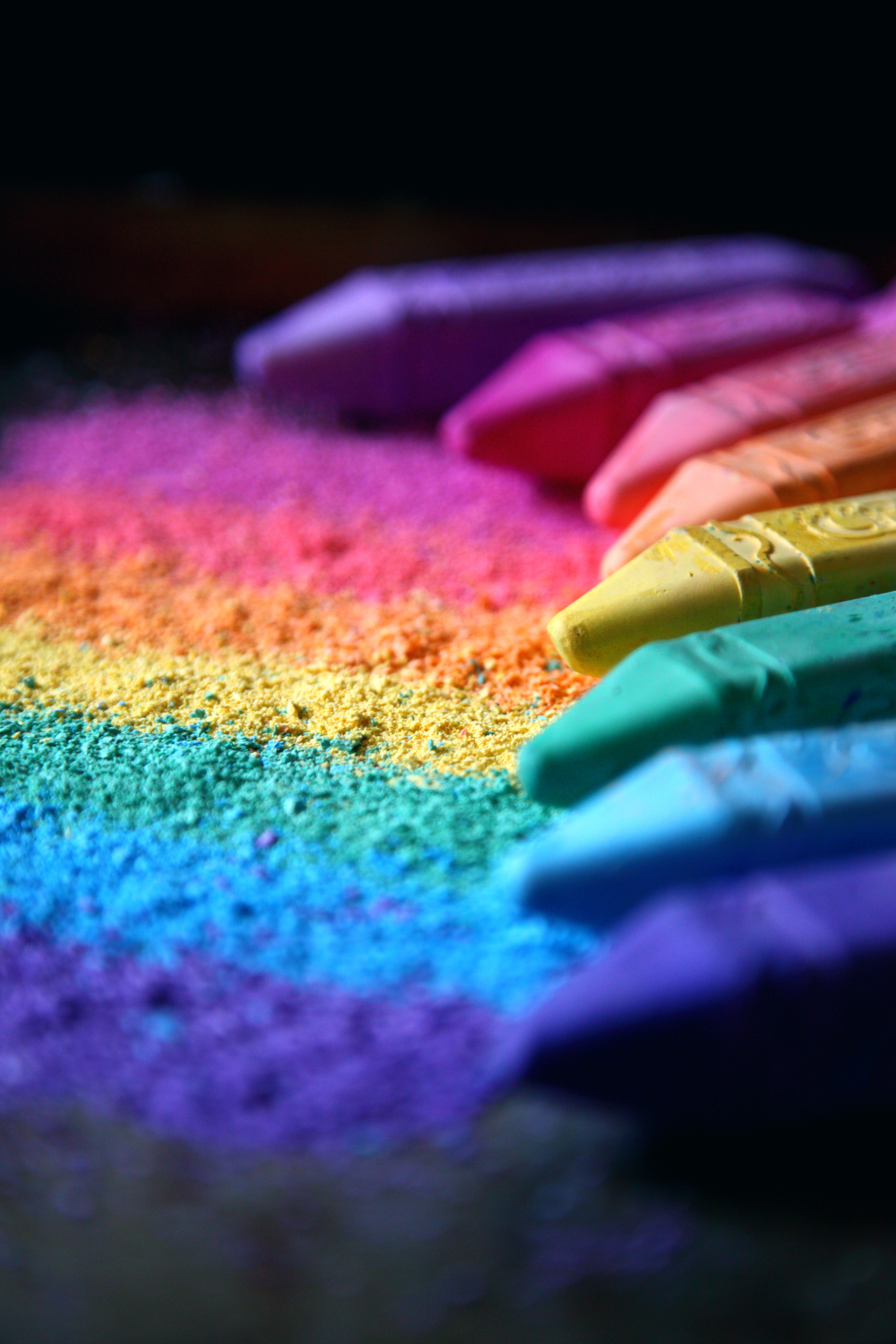 bright colour crayons creating a rainbow